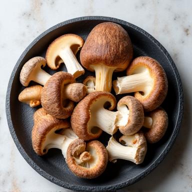 An assortment of exotic mushrooms like shiitake and oyster.
